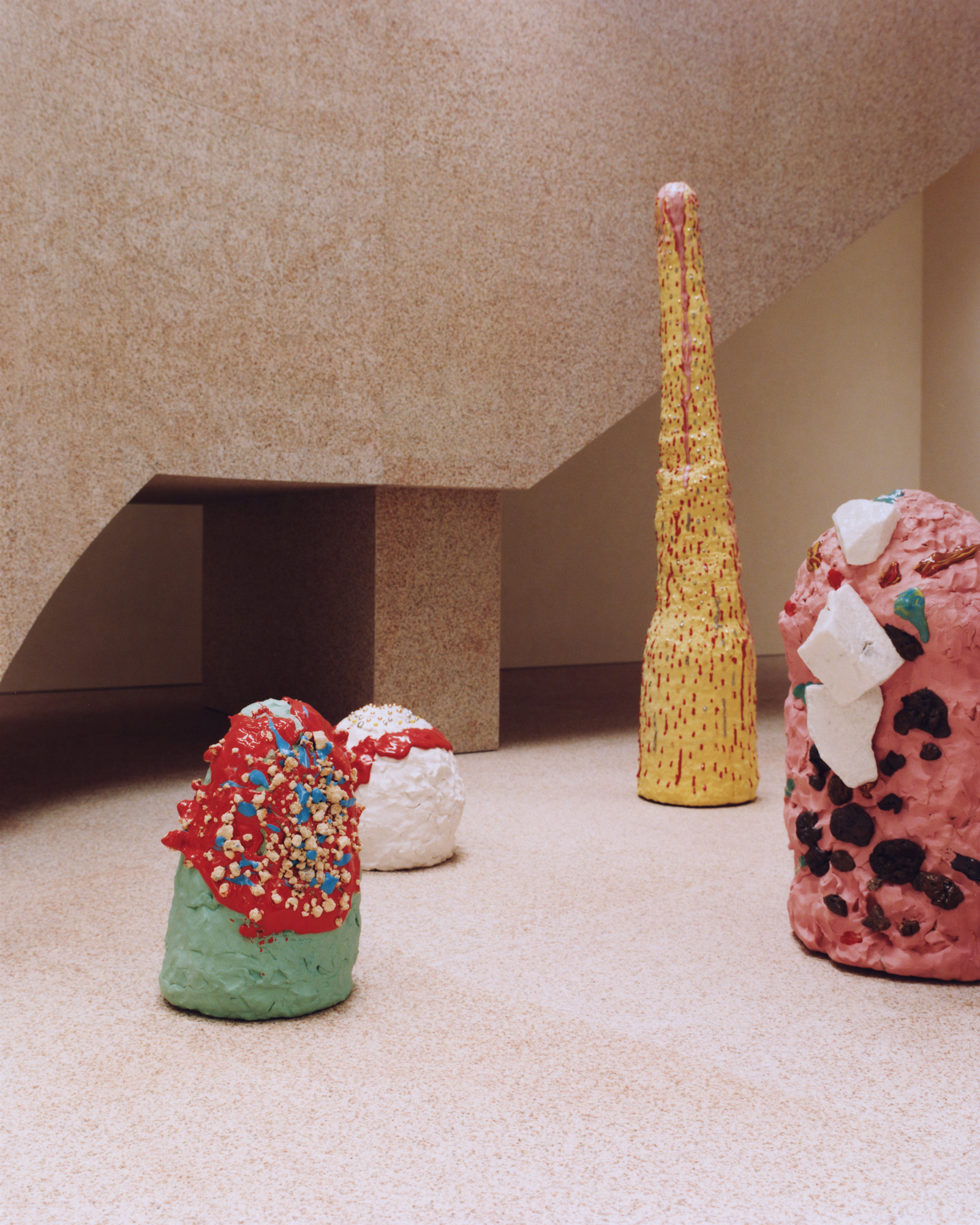 Inside the Acne Studios Aoyama flagship: pink granite, Max Lamb seating, custom Benoit Lalloz lighting and ceramics by Takuro Kuwata