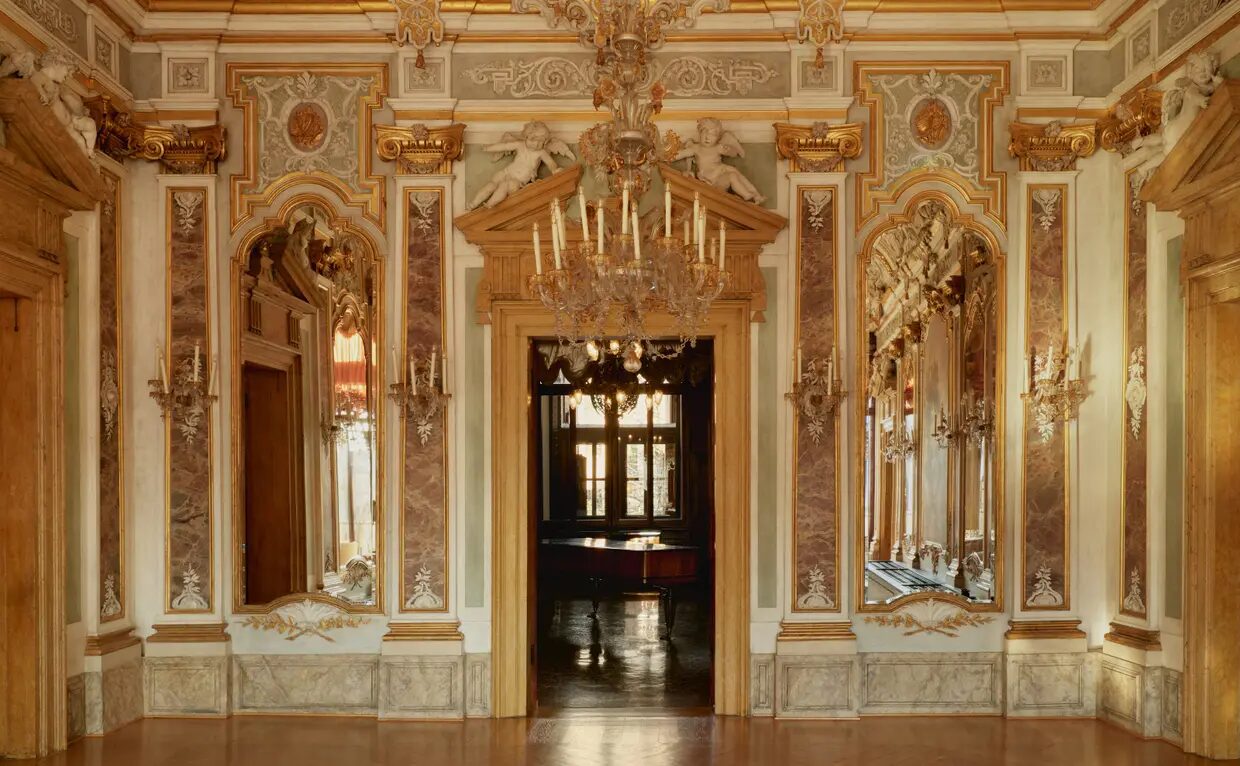 A frescoed and gilded salon on the piano nobile at Aman Venice
