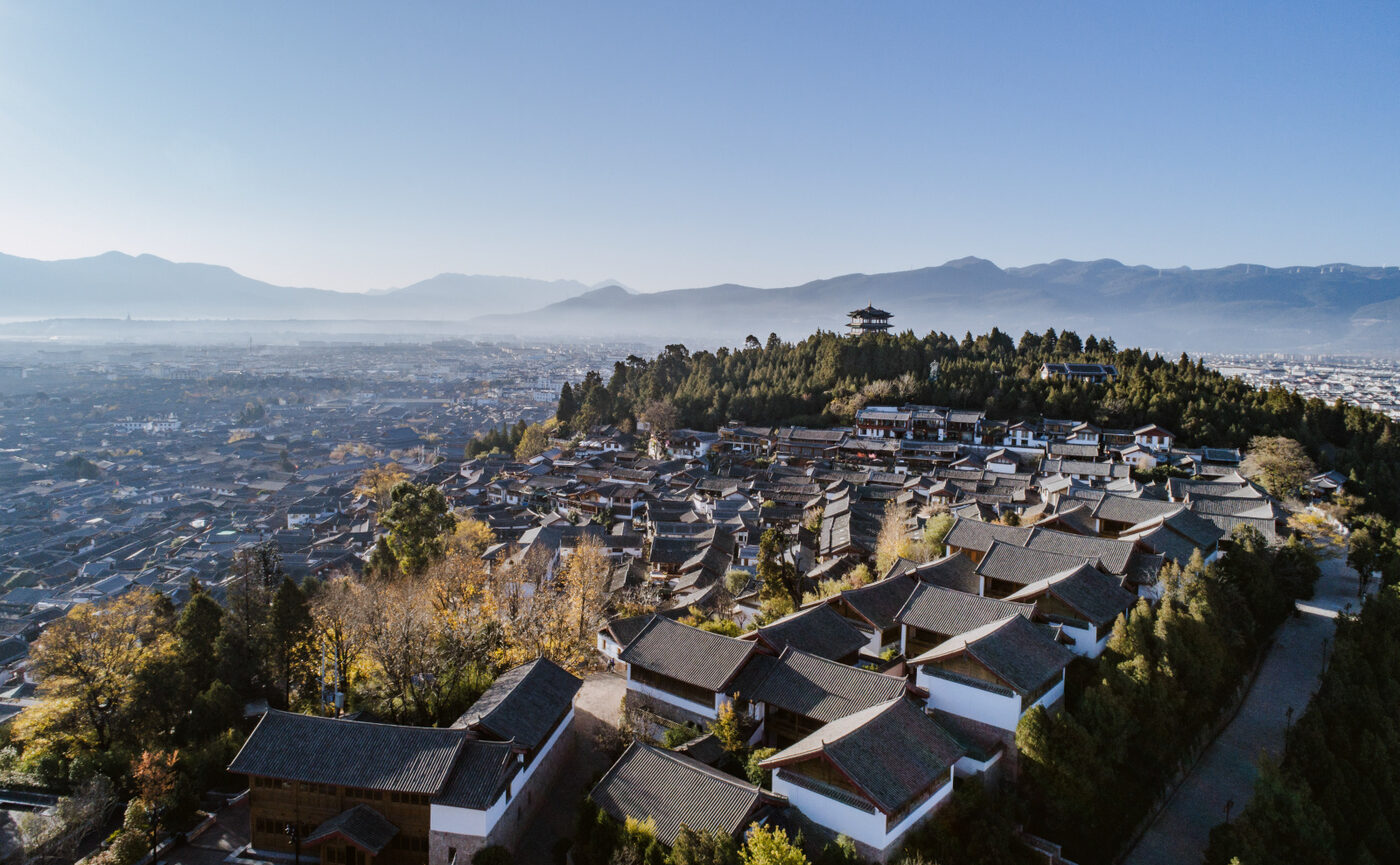 Amandayan seen from above on Lion Hill, its tiled roofs stepping down towards Lijiang Old Town, courtesy of Aman