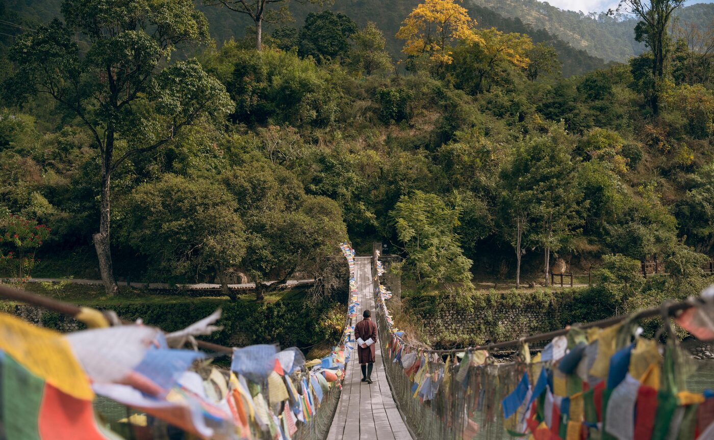 A prayer-flag suspension bridge over the river in the Punakha valley, Bhutan
