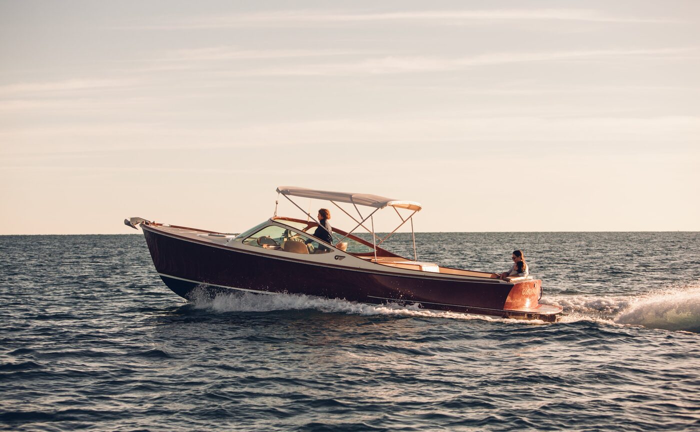 A wooden tender crossing the Sea of Cortés off Amanvari's shoreline at golden hour