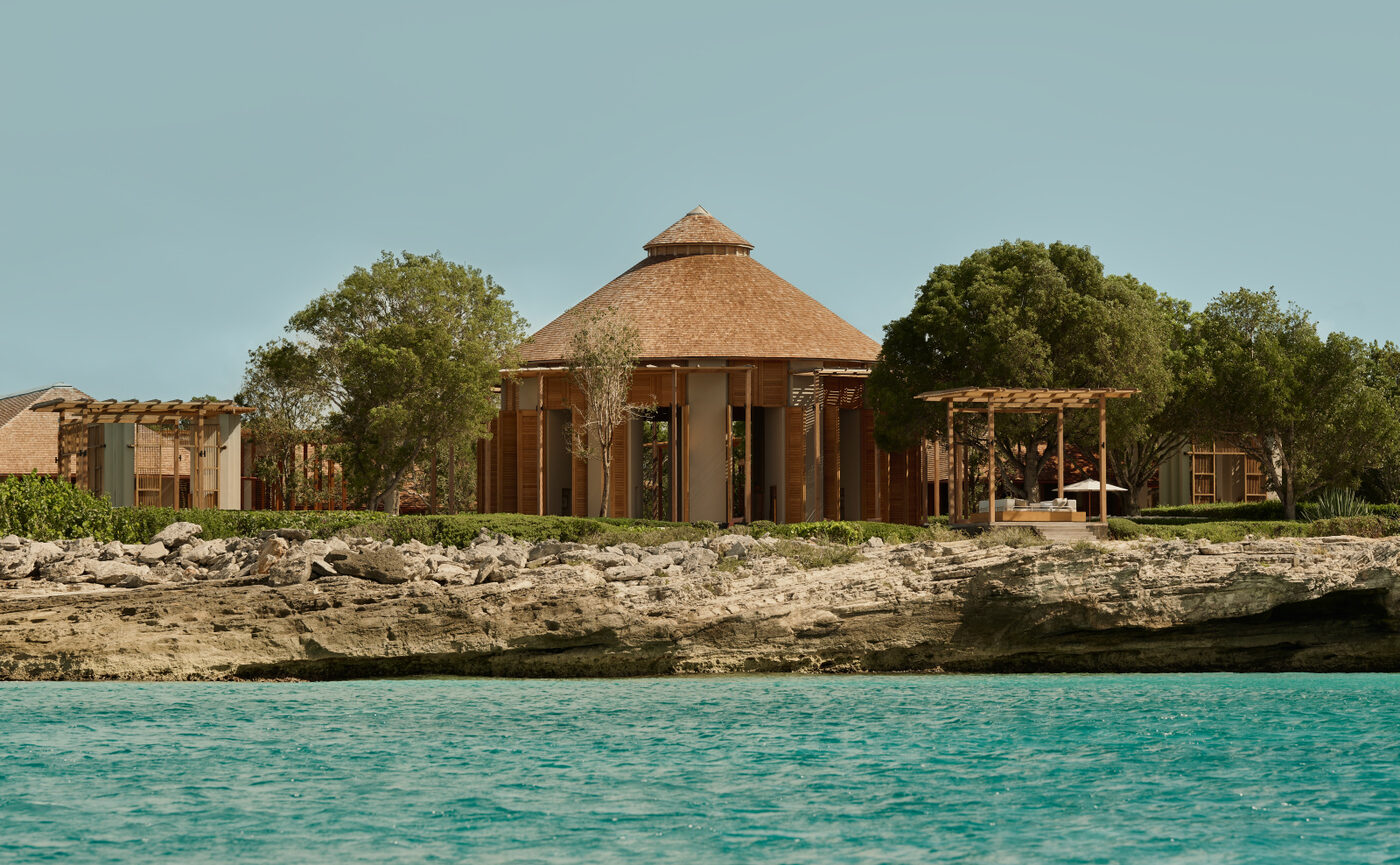 The octagonal spa pavilion at Amanyara with a terracotta roof on the shoreline of Turks and Caicos