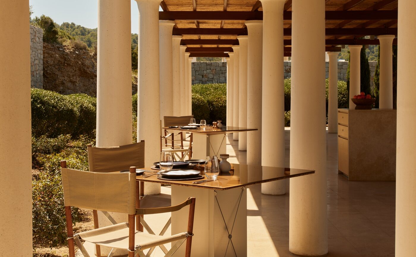 Nura, the Mediterranean restaurant at the Beach Club at Amanzoe on Korakia Beach in the Argolid, with timber tables and canopies open to the Argolic Gulf, courtesy of Aman