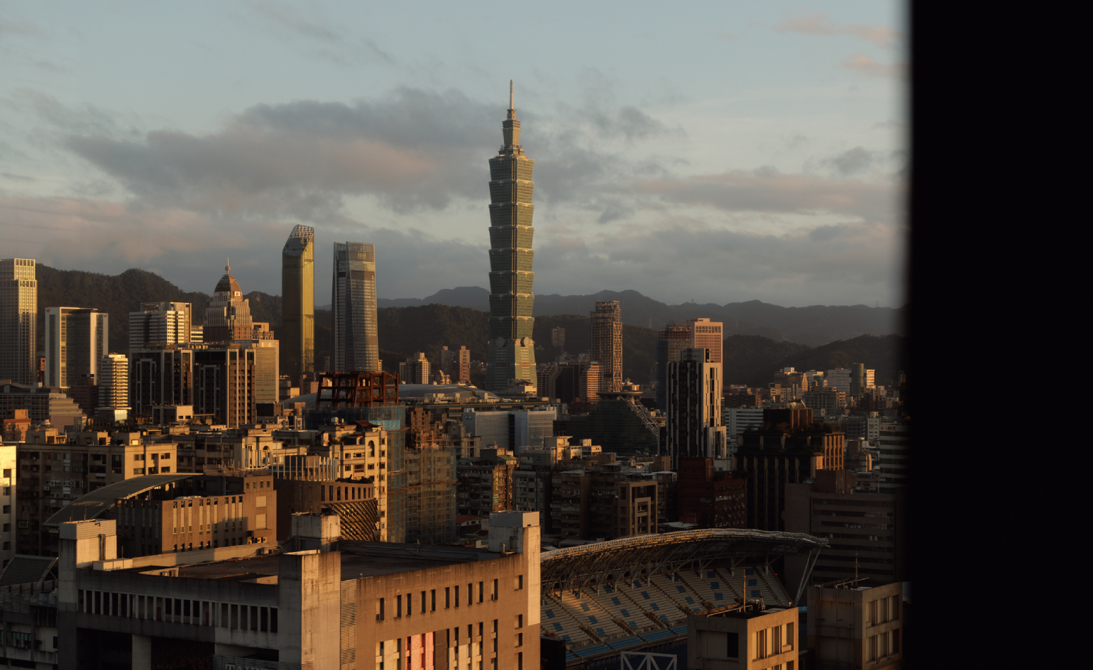 Capella Taipei hotel interior — marble vestibule with bronze doors and André Fu's monumental textile artwork