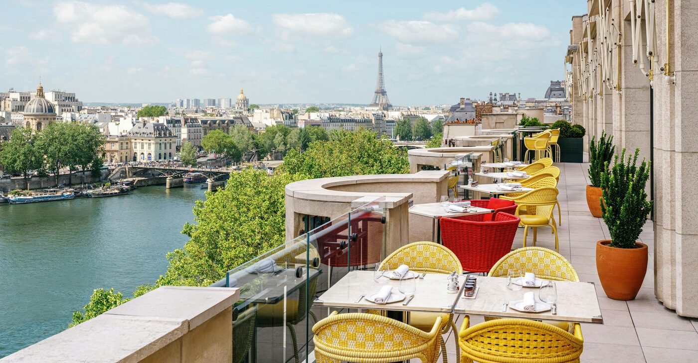 The rooftop terrace of Le Tout-Paris at Cheval Blanc Paris, overlooking the Paris skyline, courtesy of Cheval Blanc