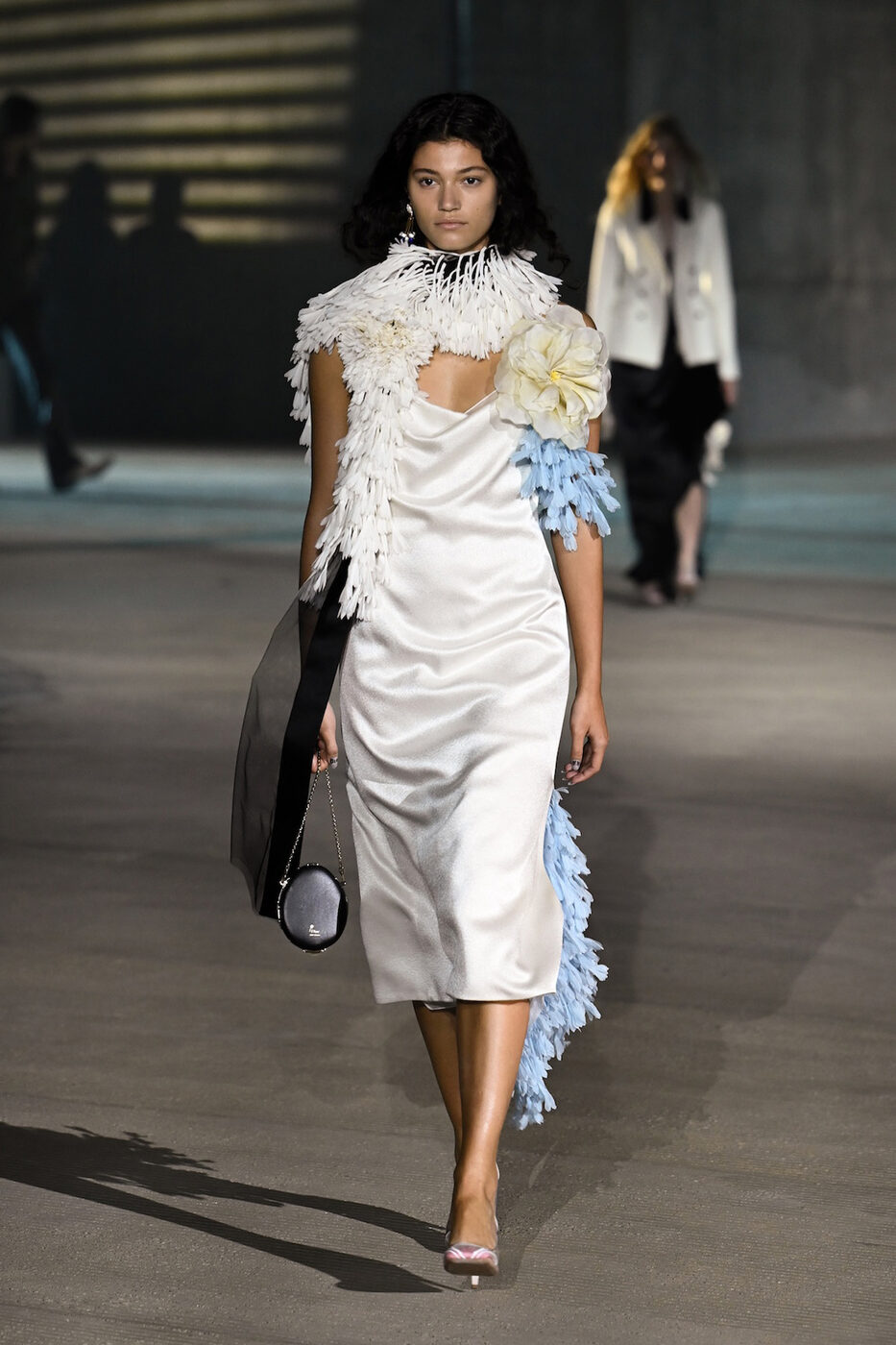 Jonathan Anderson's Dior Cruise 2027 runway show at LACMA, Los Angeles, with vintage Cadillac cars on the set