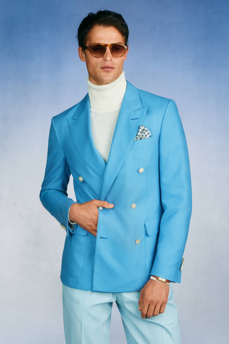 Dunhill Spring/Summer 2027, an aquamarine double-breasted blazer worn with a white turtleneck