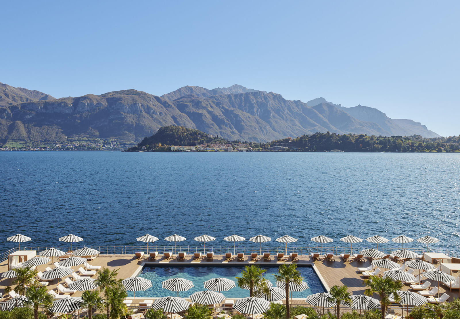 The Lake Como EDITION &mdash; lakefront pool with mountain panorama