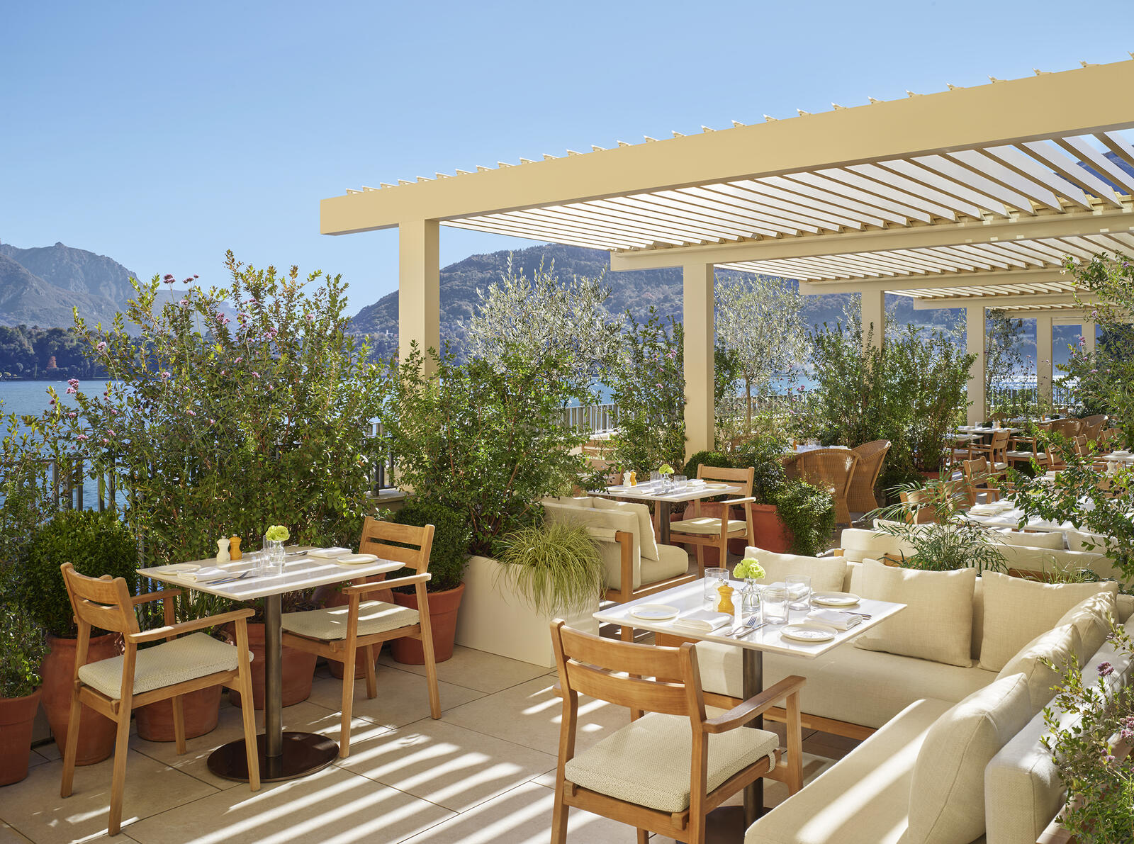 Renzo terrace restaurant at The Lake Como EDITION — olive trees, lake views, pergola shading