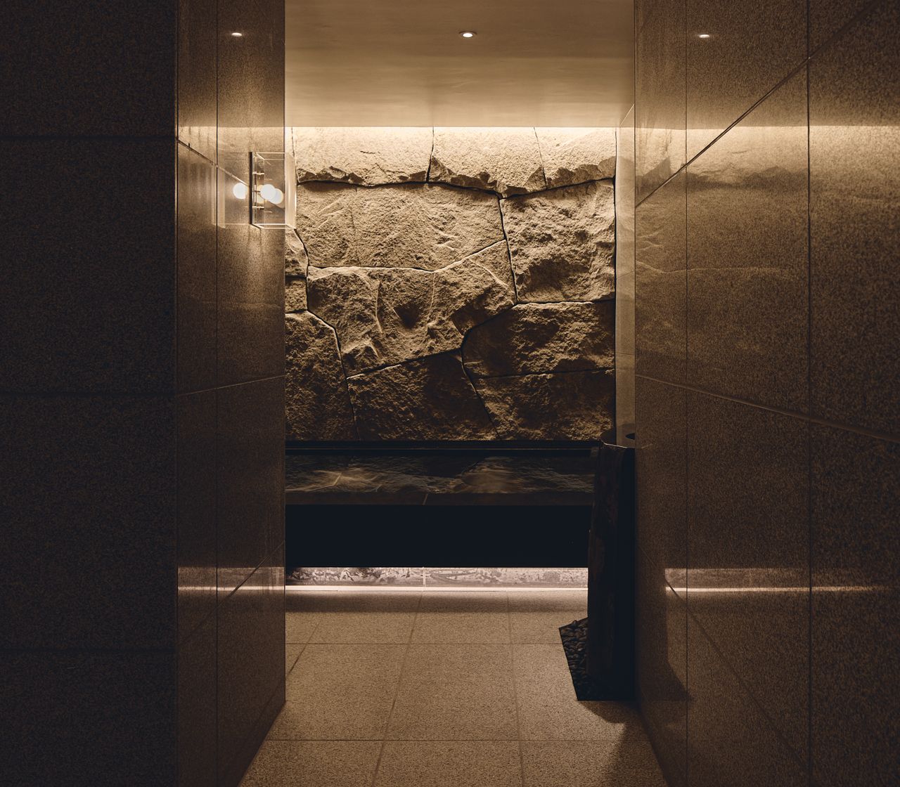 Fairmont Spa at Fairmont Tokyo, with quartzite island bench and warm stone tones