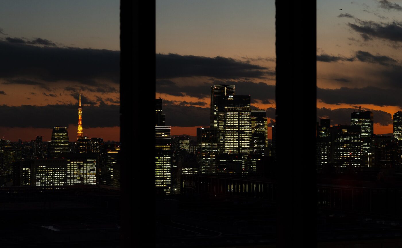 The Tokyo skyline at dusk from Aman Tokyo, Tokyo Tower lit at the left of the frame, courtesy of Aman