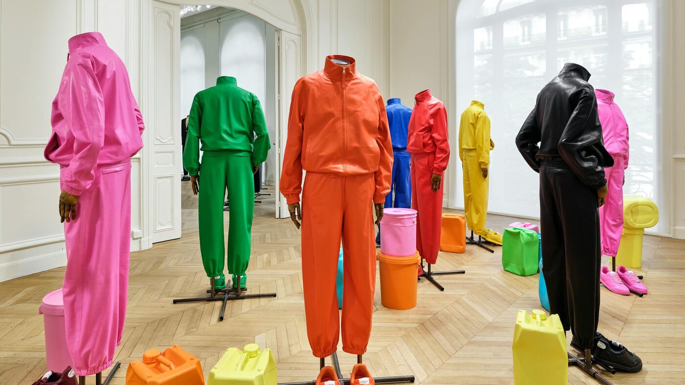 Givenchy Spring-Summer 2027 silk tracksuits in pink, green, orange, red and black on mannequins inside the panelled salons of 3 Avenue George V, with brightly coloured Rachel Whiteread casts on the parquet