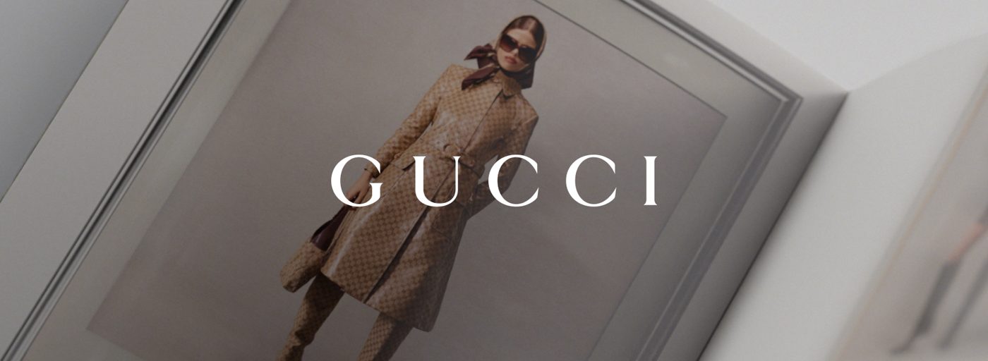 Gucci Fall/Winter 2026 campaign, a model in a Gucci look beneath the house wordmark