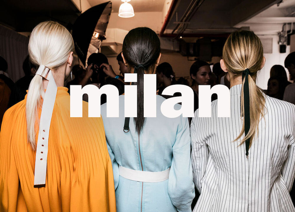 An editorial impression of Milan Fashion Week, models seen from behind backstage