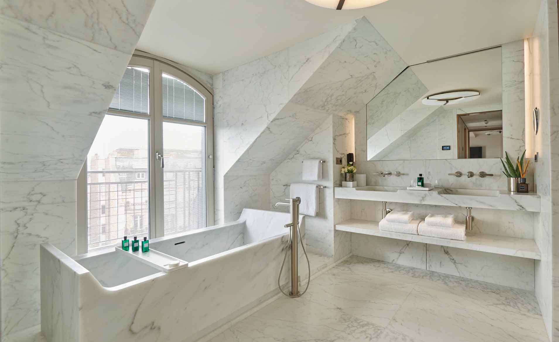 The Carrara marble bathroom of a Signature Suite at Mandarin Oriental Lutetia, Paris