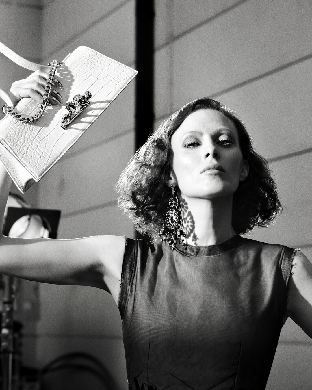 A model in the McQueen autumn/winter 2026 campaign, shot in noir by Glen Luchford