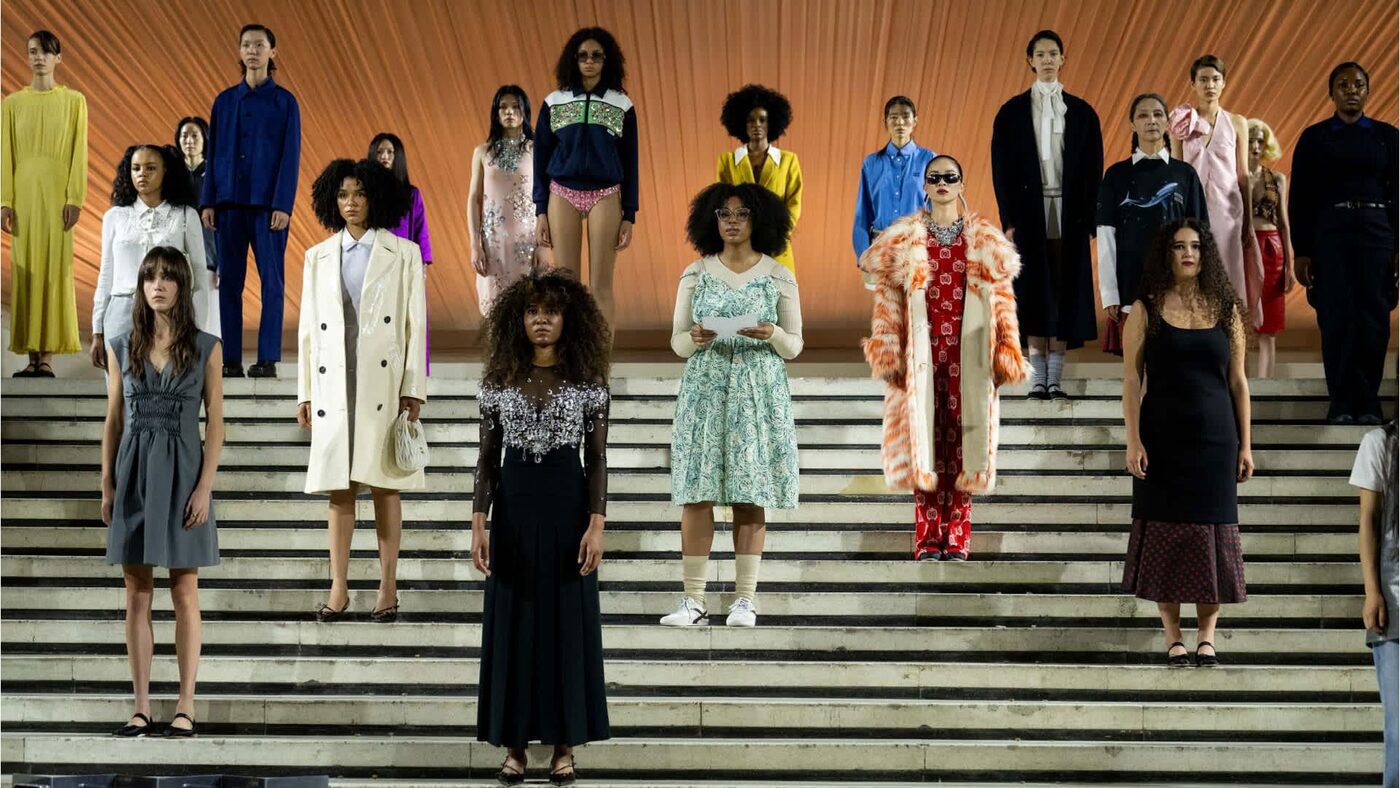 Performers in Miu Miu looks gathered on the steps at Tales & Tellers, Shanghai