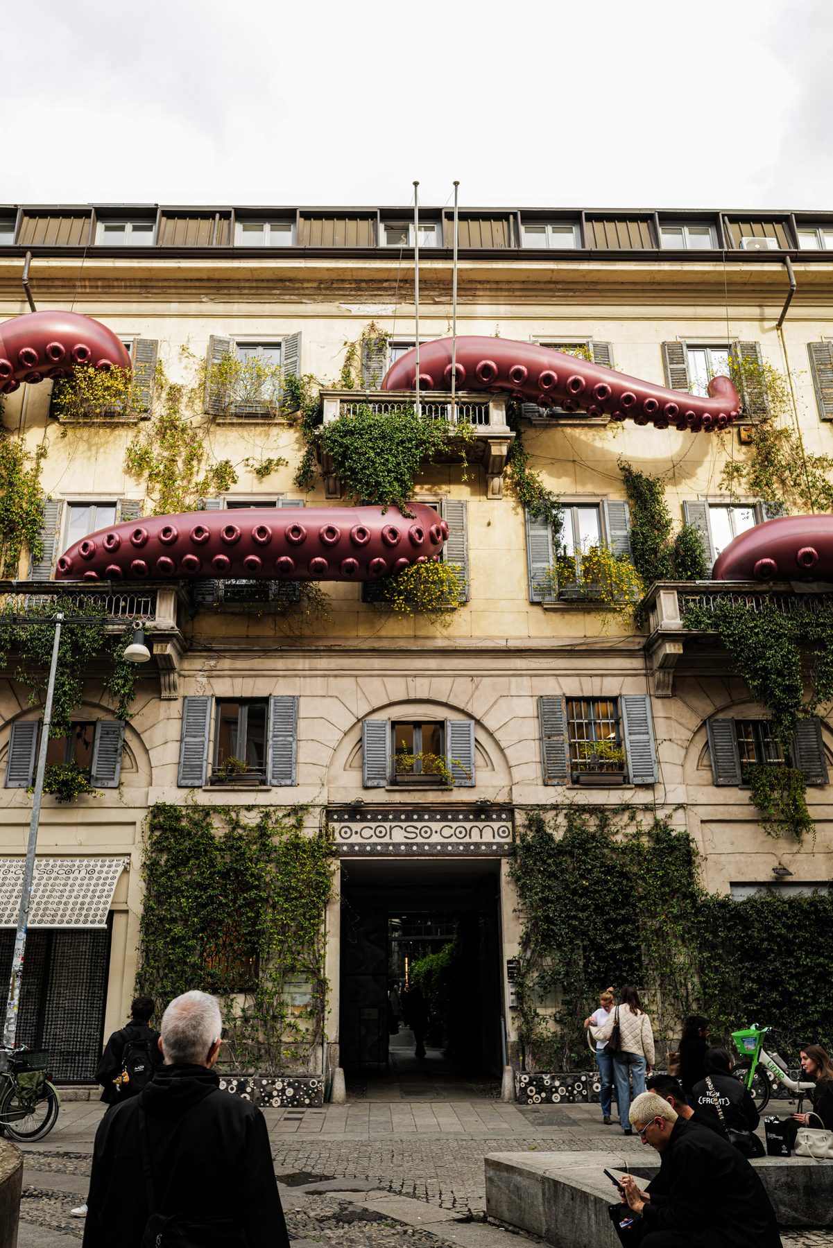 Moncler Puffy Summer takeover of 10 Corso Como, Milan, with oversized inflatable octopus tentacles on the façade