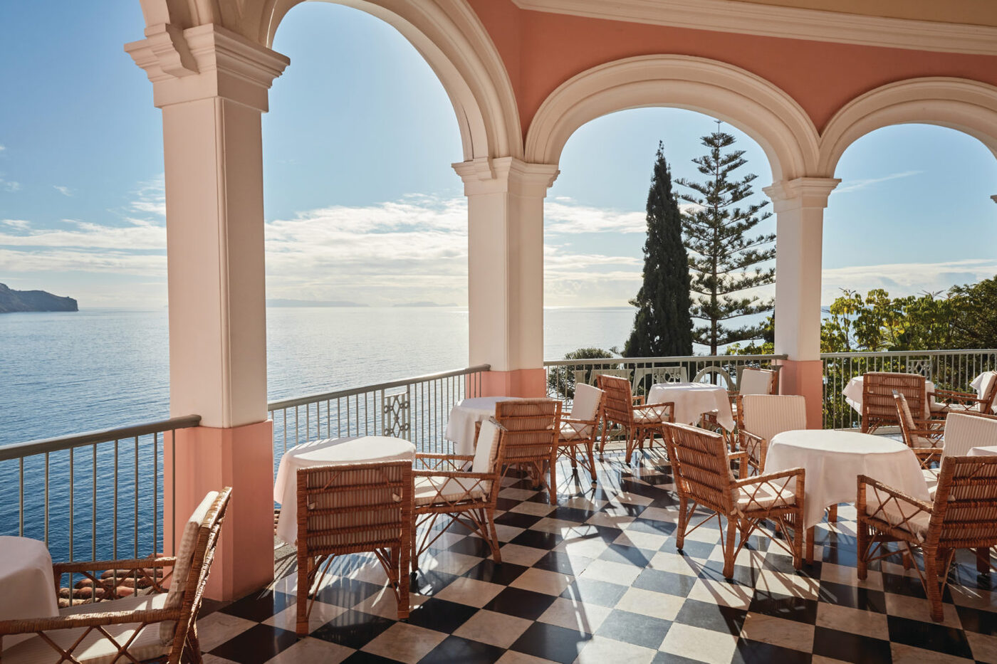 Afternoon tea laid out on the terrace at Reid's Palace, A Belmond Hotel, Madeira, courtesy of Belmond