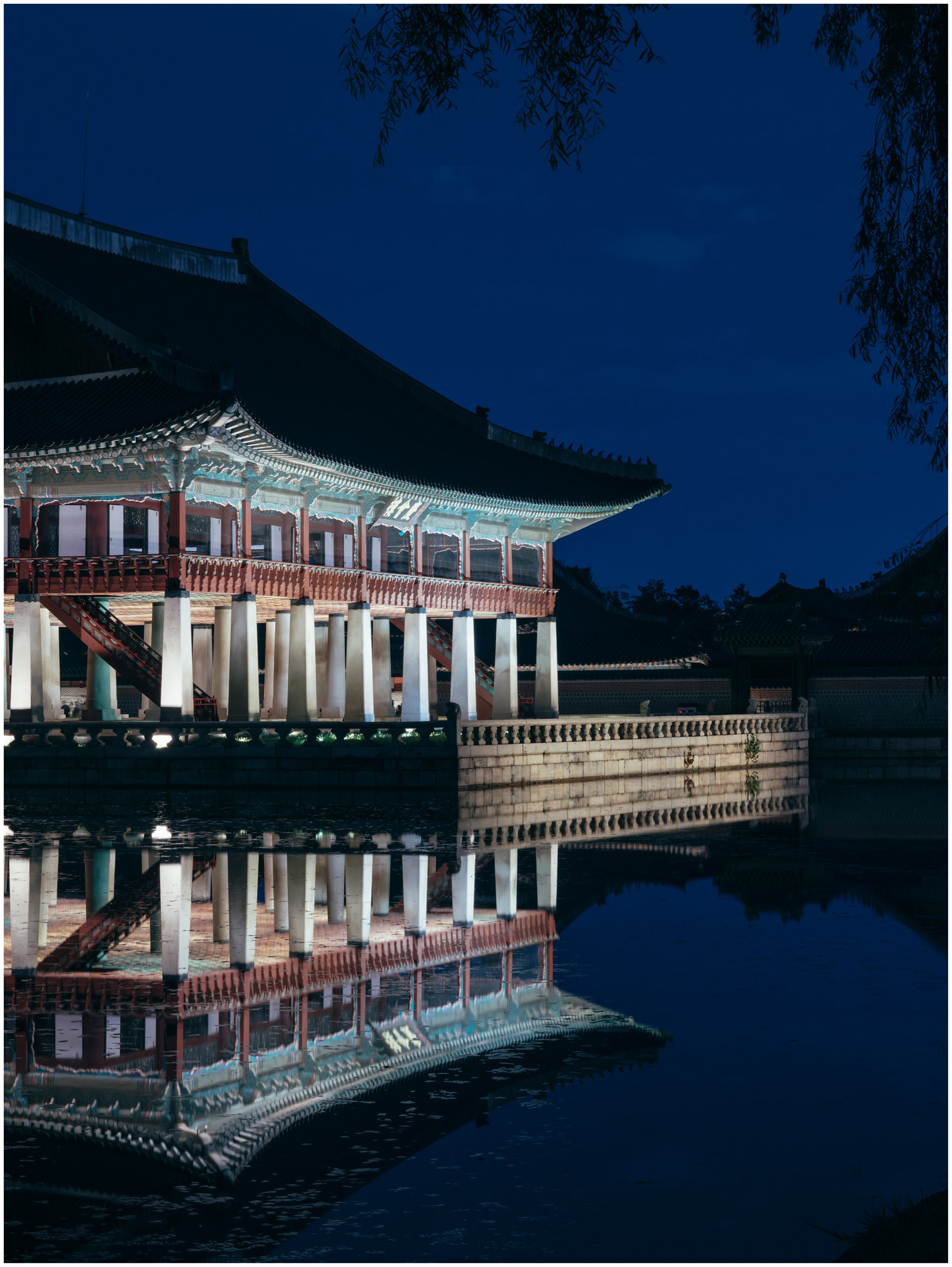 Gyeongbokgung Palace reflected in water at night, Seoul