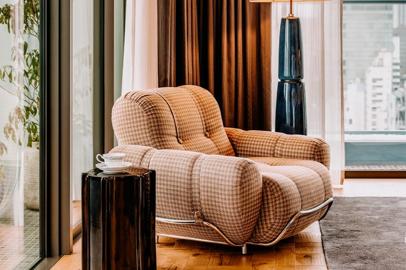 An Extra Large bedroom at Soho House Tokyo with kimono-fabric cushions