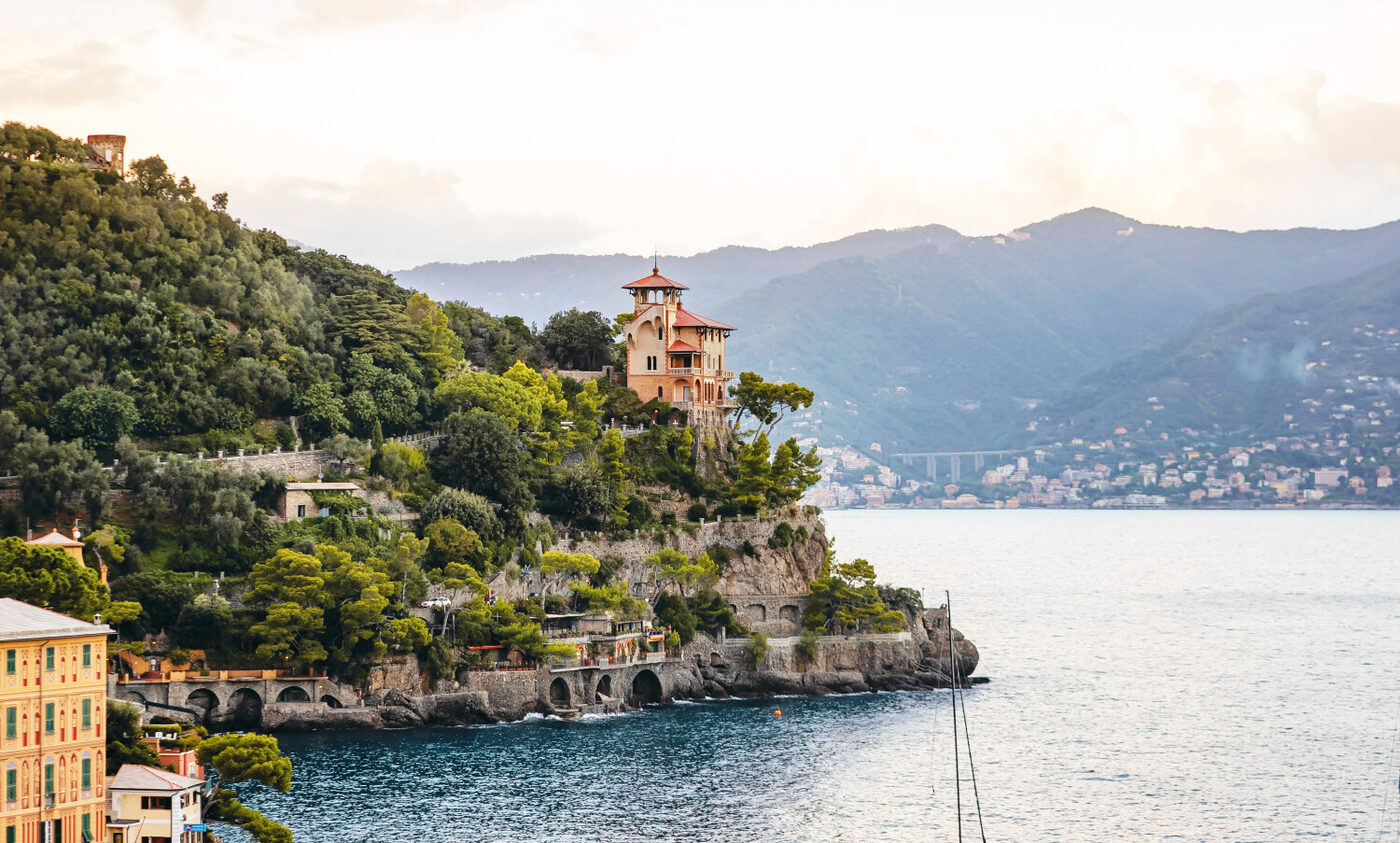 Villa Beatrice, a turreted red-roofed residence on a wooded promontory above the Gulf of Portofino